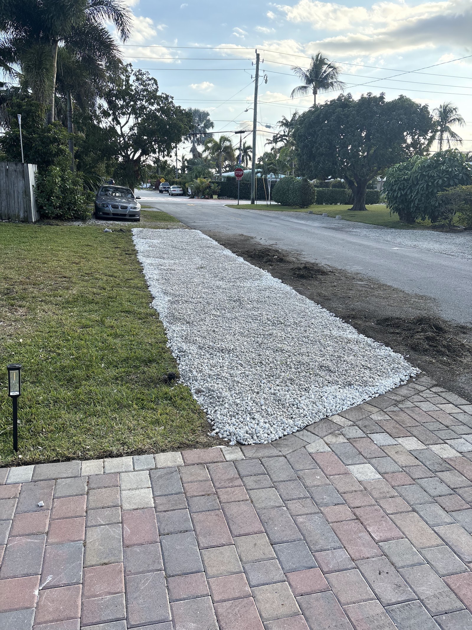 New sod and gravel walkway installed